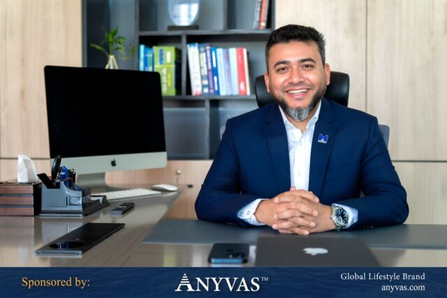 Hasan Imam Siddiki confidently sits in his office chair at Hasan Mohin Chartered Accountants. Image sponsored by ANYVAS.