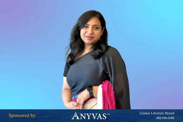 Farha Naz Zaman standing confidently in a traditional sharee, radiating elegance and professionalism. Sponsored by Anyvas.