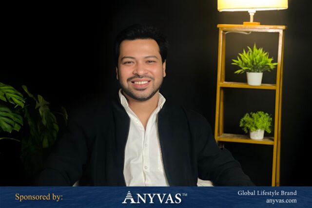 Md. Tajdin Hassan sitting confidently in a chair in his office, radiating leadership and optimism, sponsored by Anyvas.