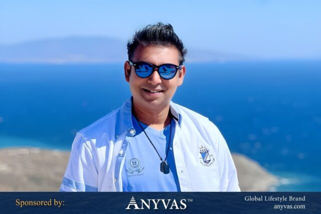 Sharfaraz Mehedi Anwar (Upol) standing confidently in front of an ocean, embodying leadership and elegance; news and photo sponsored by ANYVAS.