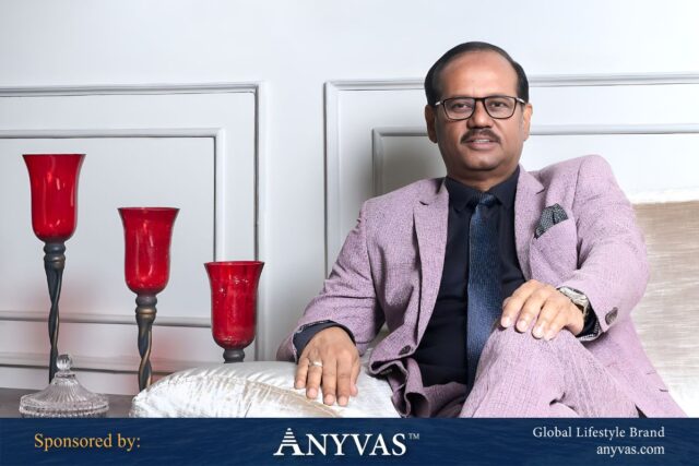 Md. Shahidullah Azim sitting on a sofa, exuding leadership and professionalism; image and news sponsored by Anyvas.