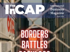 April 2025 cover of The InCAP Magazine featuring a fenced view of shipping containers, with bold red text reading “Borders, Battles, Backlogs” and a subheadline “How Geopolitics is Reshaping Global Trade.” Presented by the lifestyle brand Anyvas.